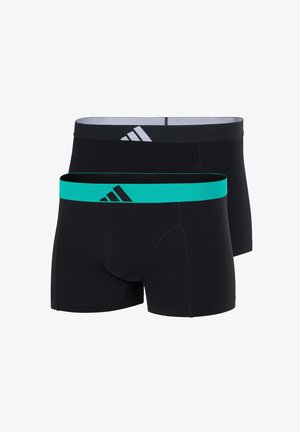 Dos pares de calzoncillos ajustados negros, uno con una cinturilla turquesa y un logo negro, el otro con una cinturilla negra y un logo blanco.