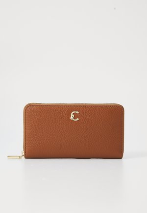 Brown leather wallet with a textured surface, gold hardware accent, and a small logo on the front. Features a zip closure.