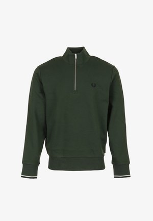 Sweat-shirt vert foncé avec une fermeture éclair à moitié, des poignets côtelés avec des rayures blanches et un petit logo sur la poitrine. Fabriqué en tissu doux et texturé.