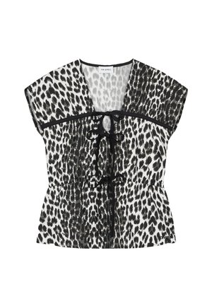 Zwart-witte blouse met luipaardprint, capmouwtjes, een peplumtaille en een strikdetail bij de halslijn. Doorschijnende stof met contrasterende bies.