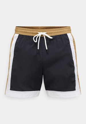 Vyriški jūros mėlynos spalvos maudymosi šortai su rudos ir baltos spalvų šoninėmis panelėmis. Turi elastingą juosmenį su raišteliu ir lygios tekstūros audinį.