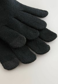 Crne pletene rukavice s pet prstiju, s teksturiranom završnom obradom i glatkim vrhom za korištenje na touchscreen uređajima. Bez vidljivih marki ili uzoraka.