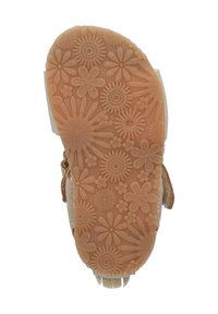 Rubberen schoenzool met bloem- en stralingspatronen. Kleur is lichtbruin met een gestructureerd, flexibel oppervlak.