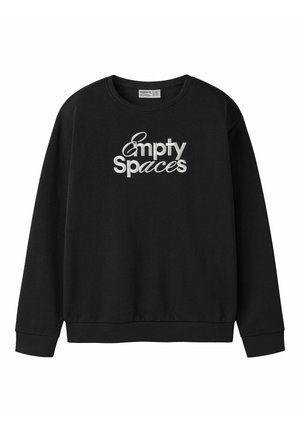 Sort langærmet sweatshirt med ribstrikkede manchetter og kant, med hvidt broderet tekst "Empty Spaces" på fronten.