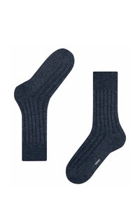 Marineblaue gerippte Socken aus weichem Stoff, mit verstärkter Zehen- und Fersenpartie. Mit einem aufgenähten Logo in der Nähe des Bündchens.