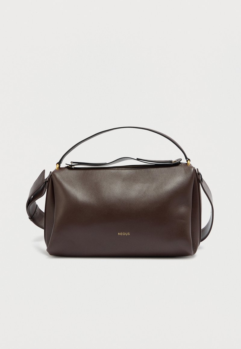 Brown leather shoulder bag with a structured design, featuring a gold logo, a top zip closure, and a detachable strap. Smooth texture.