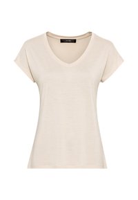 Beżowy t-shirt z dekoltem w serek wykonany z miękkiego materiału. Krótkie rękawy i luźny krój, o gładkiej fakturze i minimalnie widocznych szwach.