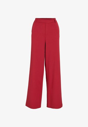 Czerwone spodnie typu wide-leg o gładkiej fakturze, z elastycznym pasem i detalami w postaci zagięcia z przodu, co nadaje im elegancki wygląd.