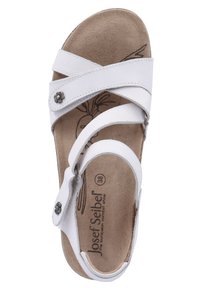 White sandal with overlapping straps, flat sole, and adjustable buckle. Textured insole, floral accent on side, and size marked as 38.