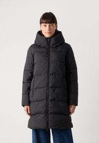 Black puffer coat with a high collar and detachable hood, featuring a front zipper, two zippered side pockets, and quilted texture.