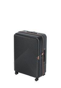 Valise rigide noire avec texture à côtes diagonales, accents en or rose et quatre roues pour la mobilité. Elle dispose d'une poignée supérieure et d'une fermeture éclair.
