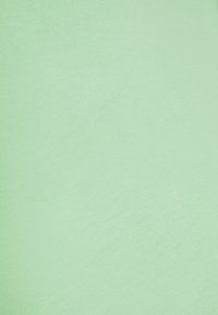 Light green cotton fabric with a smooth texture, featuring a consistent finish and subtle sheen. No patterns or notable details visible.