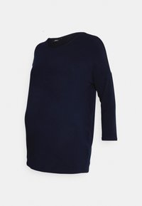 Maternity top in navy blue, made from soft fabric, features a round neckline, three-quarter sleeves, and a relaxed fit design.