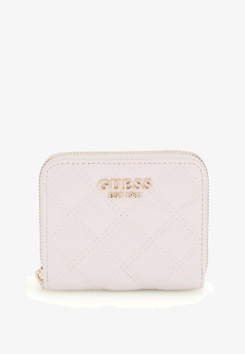 Light pink quilted wallet with gold hardware, branded "GUESS EST 1981," featuring a zip closure and compact rectangular shape.