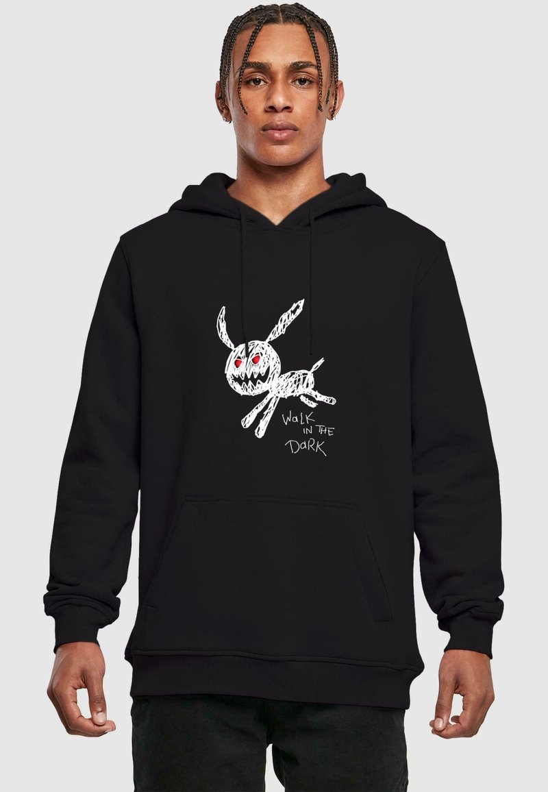 Black hoodie featuring a white, hand-drawn rabbit design with red eyes and text reading "WALK IN THE DARK." Soft cotton fabric, kangaroo pocket.