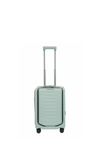 Valise rigide de cabine avec poignée télescopique extensible et quatre roues pivotantes, couleur gris clair, étiquette de marque à l'avant.