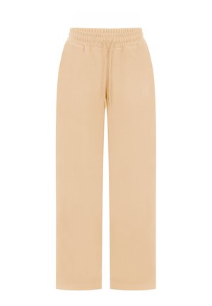Beżowe szerokie spodnie dresowe z elastycznym pasem i sznurkiem, wykonane z miękkiego materiału, casualowy i wygodny styl.