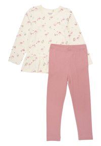 Light cream top with pink flamingo print and peplum hem, paired with solid pink leggings. Both made from soft, comfortable fabric.