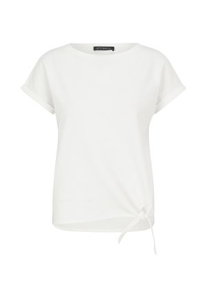 Witte korte mouwen top gemaakt van zachte stof met een ronde halslijn en een knoopdetail aan de zijkant, met een relaxte pasvorm en opgerolde mouwen.