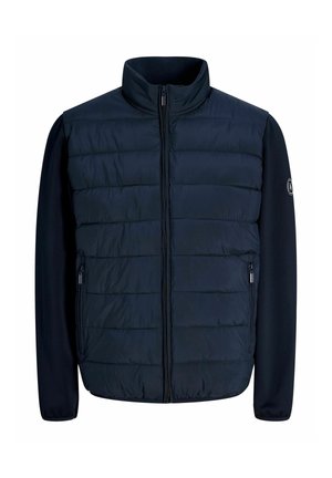 Veste hybride bleu marine avec panneau avant matelassé, manches longues lisses, fermeture éclair sur le devant et poches latérales zippées.