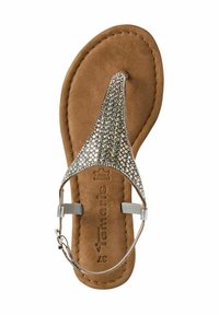 Bruna mocka flip-flop sandal med en framträdande silvrig rhinestones tårem och ankelrem. Sytt detaljer på sulan.