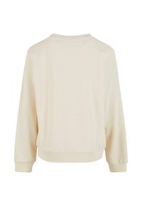 Krämfärgad sweatshirt med rundad hals, lång ärm, ribbade muddar och avslappnad passform, tillverkad av mjukt material med en slät yta.