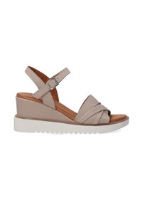 Béžové kožené espadrilky na klínu s uzlovým designem vpředu, nastavitelným popruhem na kotníku a bílou gumovou podrážkou s textura.