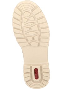 Semelle de chaussure en caoutchouc blanche avec de profonds crampons et une surface texturée, comportant un petit logo rouge et une indication de taille près du talon.