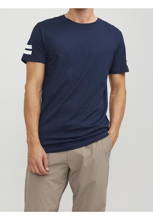 Navy blue cotton t-shirt featuring a crew neck, short sleeves, and white horizontal stripes on the left sleeve. Smooth texture, relaxed fit.
