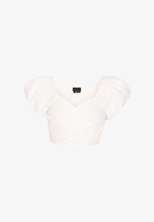 Blouse blanche courte avec manches courtes bouffantes et encolure en V style cache-cœur, présentée sur un fond blanc uni.