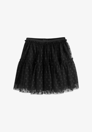 Falda negra de varias capas con tejido transparente de lunares, cintura elástica y detalles recogidos con volantes.