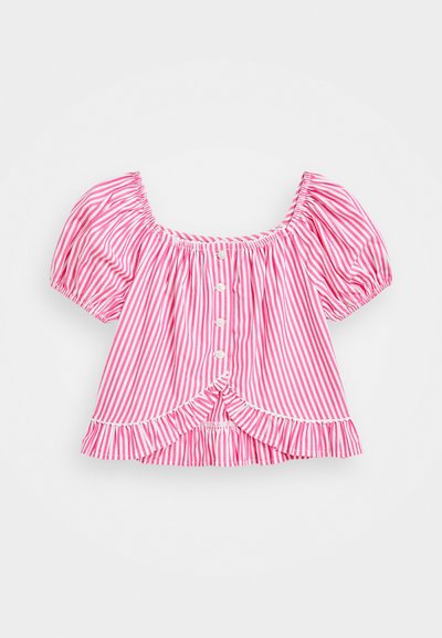 Rožinė ir balta vertikaliomis juostelėmis trumpomis rankovėmis palaidinė, turinti kvadratinį iškirpimą, mygtukų užsegimą ir raukšlėtą apatinę dalį. Pagaminta iš lengvos medžiagos.