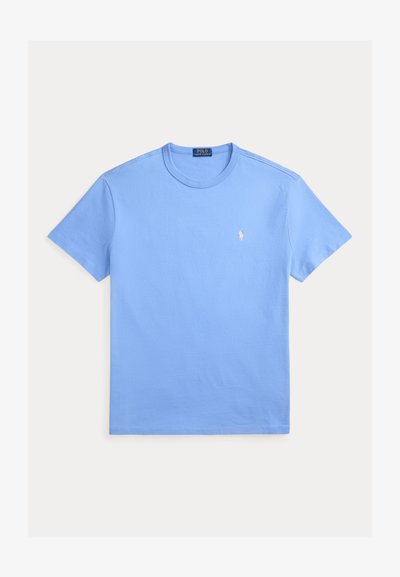 Hele sinine lühikeste varrukatega nööbita puuvillane t-särk, mille vasakul rinnal on väike valge Ralph Laureni Polo logo tikitud.