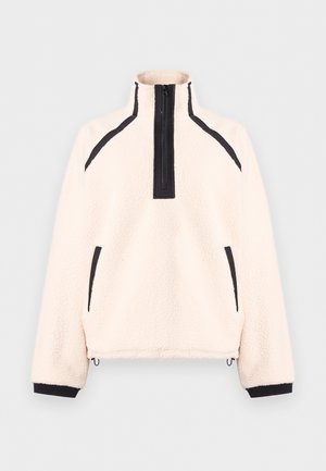 Cremefarbener Fleece-Pullover mit schwarzem Viertelreißverschluss, schwarzem Besatz an Schultern, Taschen, Bündchen und verstellbaren Kordelzügen am Saum.