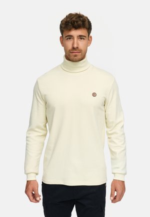 Pull col roulé jaune clair avec une texture côtelée et des manches longues. Présente un petit logo marron sur la poitrine.