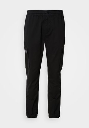 Black cargo pants with elastic waistband, button closure, two side pockets, and two cargo pockets. Smooth fabric with a relaxed fit.