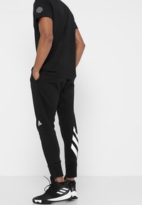 adidas Performance Teplákové kalhoty - black