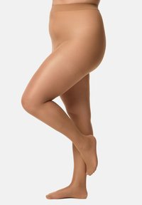 Pantys nude transparentes con una textura suave, diseño de cintura alta y una cinturilla elástica y suave, que muestran un tono de piel natural para un uso sin costuras.