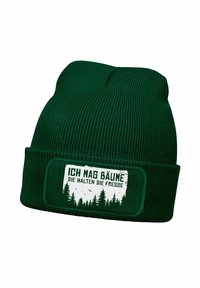 Dark green knit beanie with a textured pattern. Features a white patch with black text and a forest graphic. Classic cuffed design.