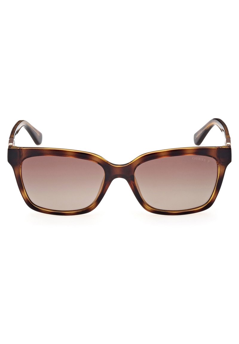 Gafas de sol de carey con montura cuadrada, lentes degradados y varillas delgadas y curvadas. La vista frontal destaca la forma y el color distintivos.