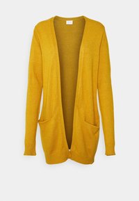 Gul stickad cardigan med öppen framsida, två framfickor och ribbade ärmar. Texturen verkar mjuk och lätt.