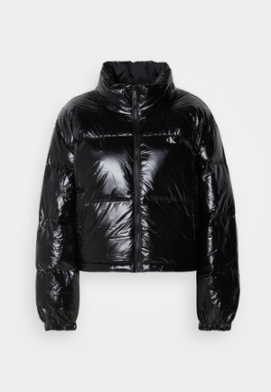 Black puffer jacket with a shiny, smooth texture, cropped design, high collar, and elasticized cuffs. Features a front zipper and logo detail.