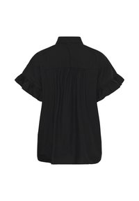 Blouse noire à manches courtes avec poignets volantés, empiècement dos froncé et ourlet droit, vue de dos sur fond blanc.