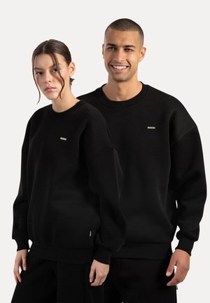 RIVEN UNISEX - Sudadera - schwarz
