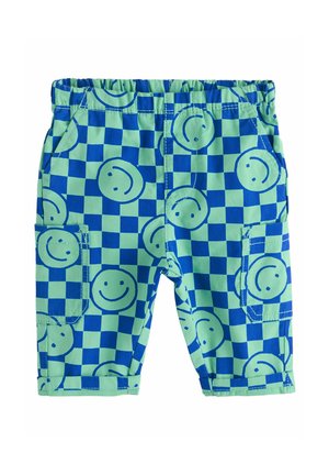 Bermuda in cotone con un motivo a scacchi blu e verdi, arricchita da faccine sorridenti. Vita elastica e tasche laterali per una maggiore funzionalità.