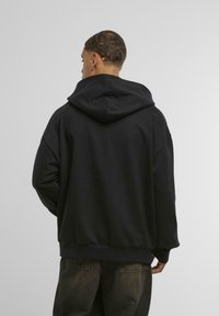 Merchcode COCA COLA REFRESHED Sweatshirt black/schwarz Zalando