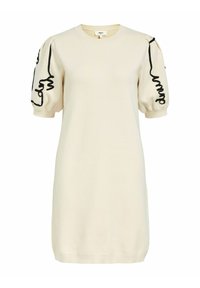 Vestido de punto color crema con mangas cortas y abullonadas que presenta bordados negros ondulados a lo largo de las costuras. Cuello redondo y dobladillo acanalado.