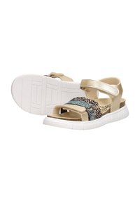 Beige sandals with a textured multi-color strap featuring metallic accents, adjustable Velcro, and a white rubber outsole.