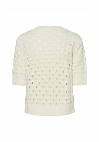 Krämfärgad stickad tröja med ett strukturerat, håligt mönster, korta ärmar och ribbade fållar. Har en rund halsringning och avslappnad passform.