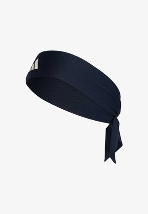 Navy fabric headband with textured surface, features a knot at one end and a logo accent. Soft, flexible design for secure fit.